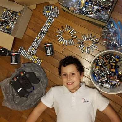 Antonio completed mission 4 and poses with all of the batteries he recycled during the Ontario Schools Battery Recycling Challenge.